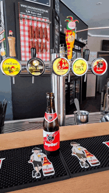 a bottle of jupiler sits on a bar top