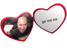 a picture of a man in a heart shaped mirror with the words " ge we es " on it