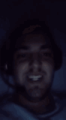 a blurry picture of a man 's face with a smile
