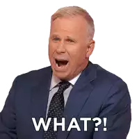 a man in a suit and tie has his mouth open and says what