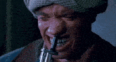 a close up of a man 's face with his mouth open
