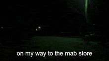 a person walking down a street at night with the words on my way to the mab store below them