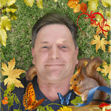 a man with a squirrel and butterflies around his face