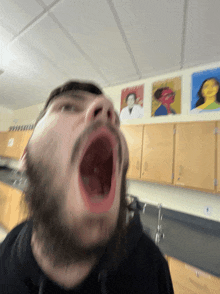 a blurry picture of a man 's face with his mouth open
