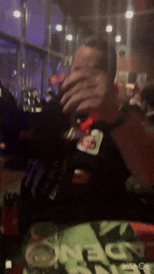 a man wearing a youtube badge covers his face with his hands