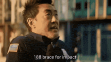a police officer has 188 brace for impact written on his shirt