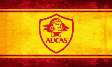 a red and yellow logo for aucas with a woman 's head