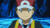 a boy wearing a red and white hat with the letter a on it