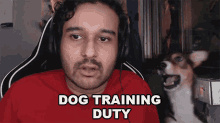 a man with headphones says dog training duty in front of a dog