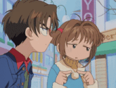 a boy and a girl are standing in front of a store that says yo on it