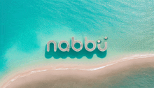 the word nabbi is written in the water on a sandy beach