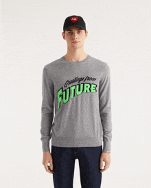 a man wearing a sweater that says greetings from future on it