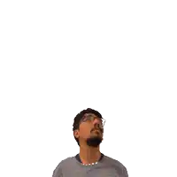a man with glasses and a beard is looking up at the number 22