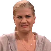 a woman with a ponytail and a necklace makes a funny face