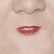 a close up of a woman 's mouth with red lipstick and a nose .