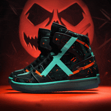 a pair of high top sneakers with a cross on them