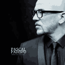 a black and white photo of a man with glasses and the name pascal padispo