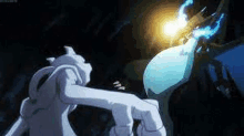 two pokemon are fighting each other in a dark room .