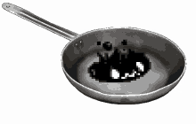 a frying pan with a black circle in it