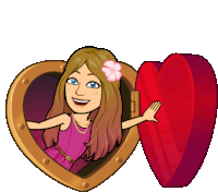 a cartoon girl with a flower in her hair is standing in a heart shaped box