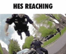 a police officer is jumping in the air with the words " hes reaching " below him