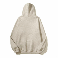 the back of a white hoodie with a zipper