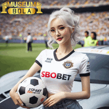 a woman holding a soccer ball with the word sbobet on her shirt