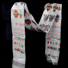 a person is holding a white scarf with chinese writing