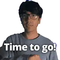 a man wearing glasses and a grey sweater says " time to go "
