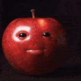 an apple with a face on it and a slice missing
