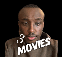 a man 's face is shown with the words 3 movies written below it