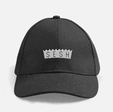 a black baseball cap has the word sesh embroidered on it