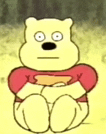 a cartoon of a winnie the pooh bear wearing a red shirt is sitting down .