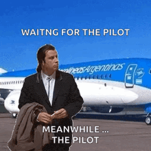 a man in a suit and tie is standing in front of an airplane and waiting for the pilot .