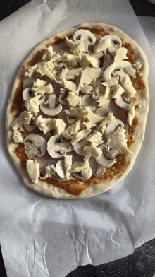 a pizza with mushrooms and cheese on top