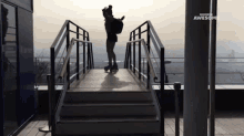 a woman rollerblading on a bridge with awesome written on the bottom of the screen