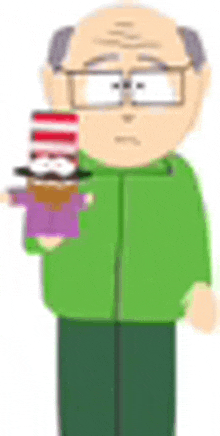 a bald man in a green jacket is holding a cat in the hat doll .