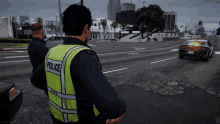 two police officers are standing on a street with a car in the background