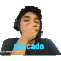 a man wearing headphones is covering his mouth with his hand and the word chocado is on the bottom right