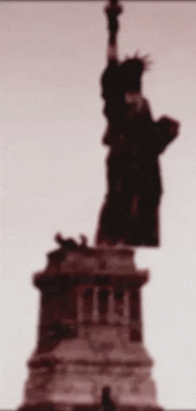 a blurry picture of the statue of liberty in new york