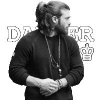 a man with long hair and a beard is wearing a black sweater with the word daer written on it