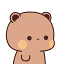 a brown teddy bear with a yellow spot on its face is looking at the camera on a white background .