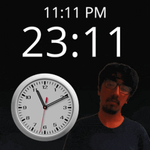 a man stands in front of a clock that says 11:11 pm on it