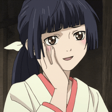 a girl with a ponytail and a hand on her cheek