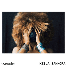 a woman with curly hair covering her face with her hands and the name keila sankofa on the bottom