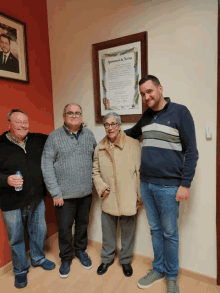 a group of people standing in front of a sign that says ajuntament de torta