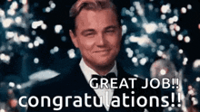a man in a suit and bow tie is smiling and saying `` great job congratulations ! ''