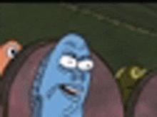 a cartoon character with a blue face is standing next to a worm .