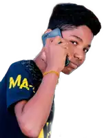 a boy wearing a blue shirt with the word ma on it talking on a cell phone