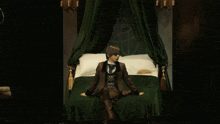 a man in a suit sits on a bed with a canopy